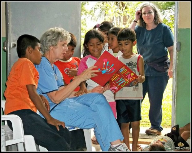 Reading a book to the kids while family members received care.